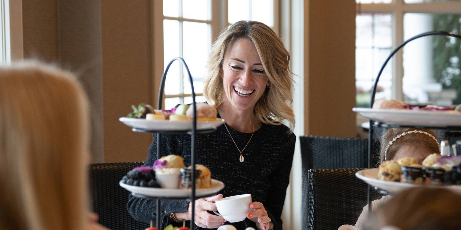 Woman laughing, Afternoon Tea service