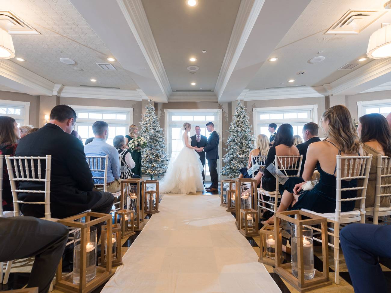 Wedding ceremony with lantern and pine decor, Sagamore Room