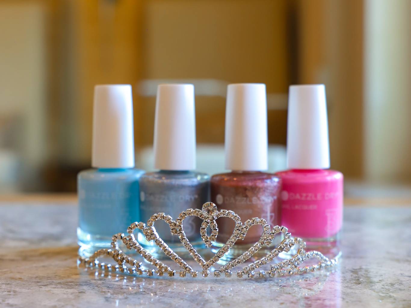 Jeweled tiara with bright, sparkly Dazzle Dry nail polishes, The Spa at Inn at Bay Harbor