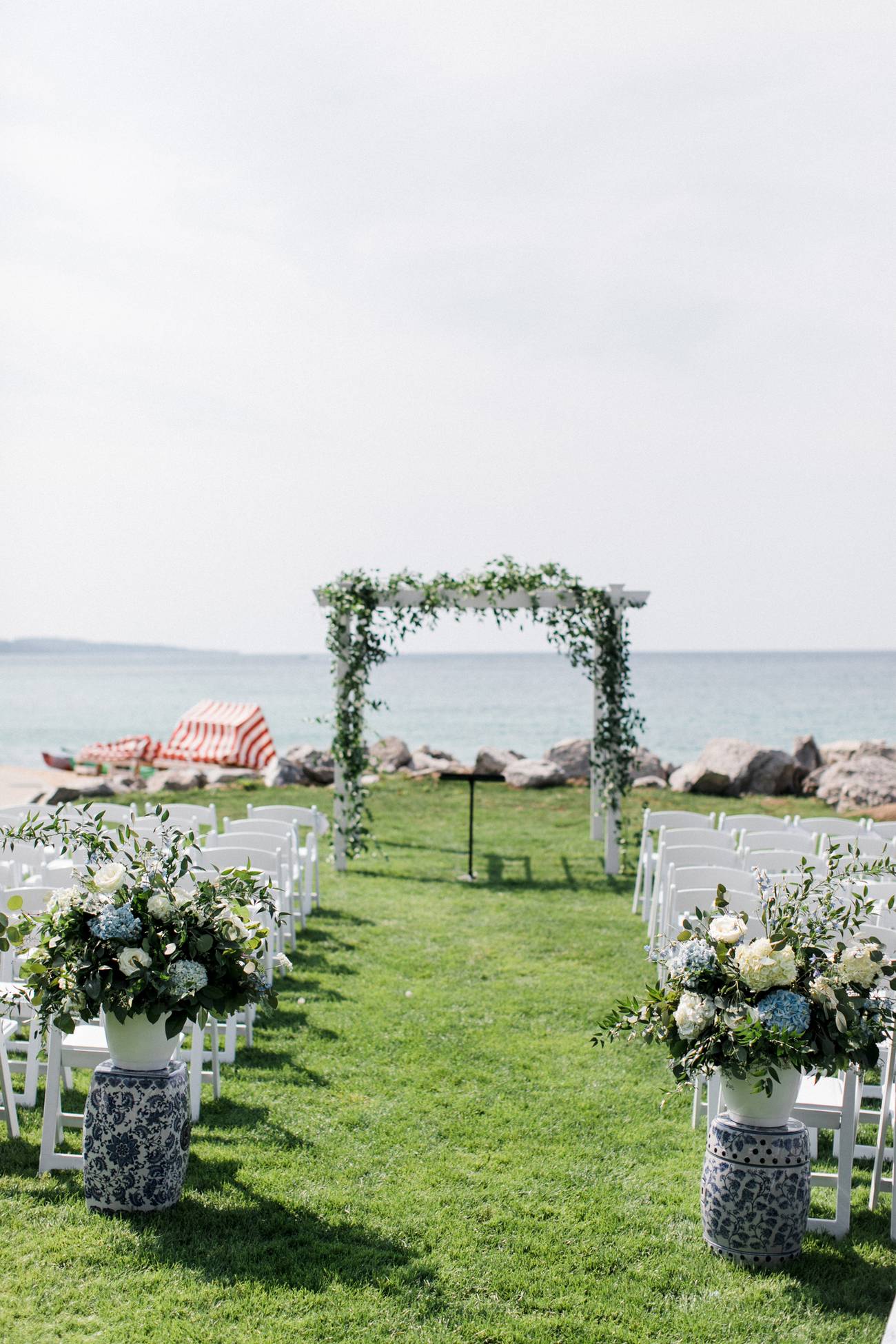 Blue hydrangea and leafy arch ceremony on Lake Michigan