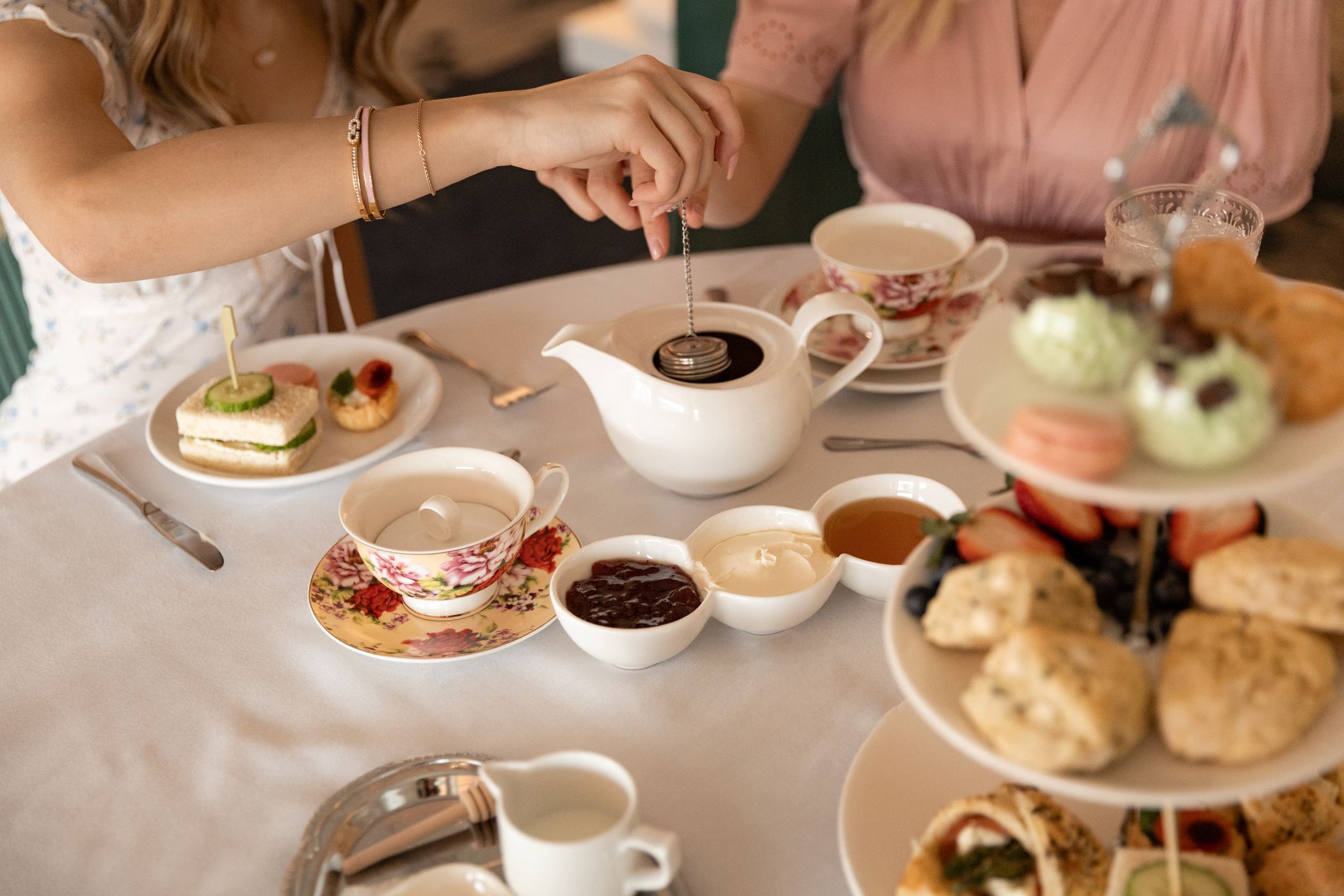 Steeping teapot over full Afternoon Tea table, Inn at Bay Harbor