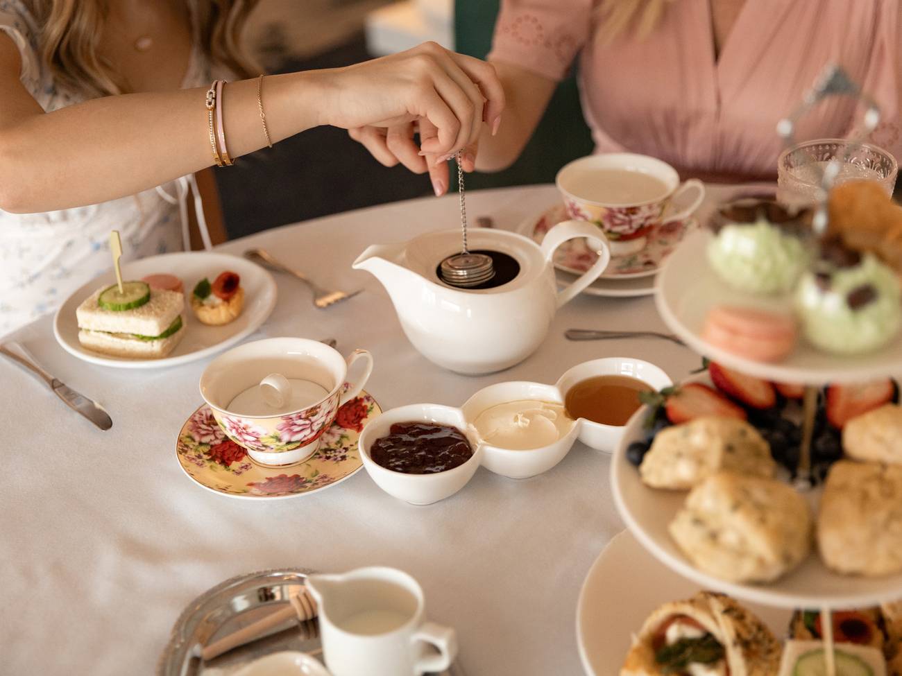 Steeping teapot over full Afternoon Tea table, Inn at Bay Harbor