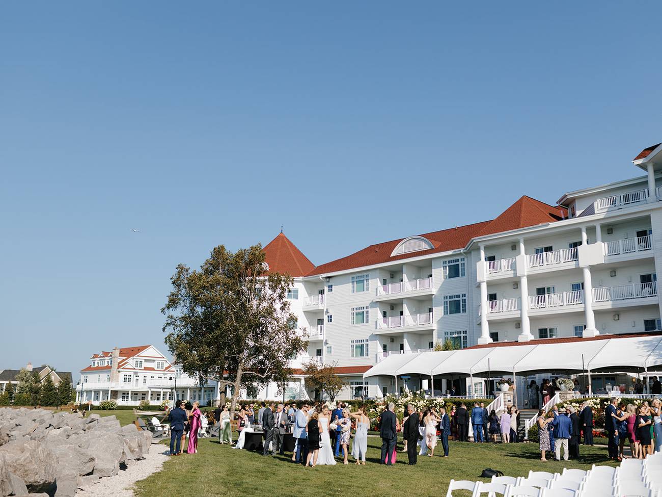Wedding guests enjoy outdoor cocktail reception, Inn at Bay Harbor