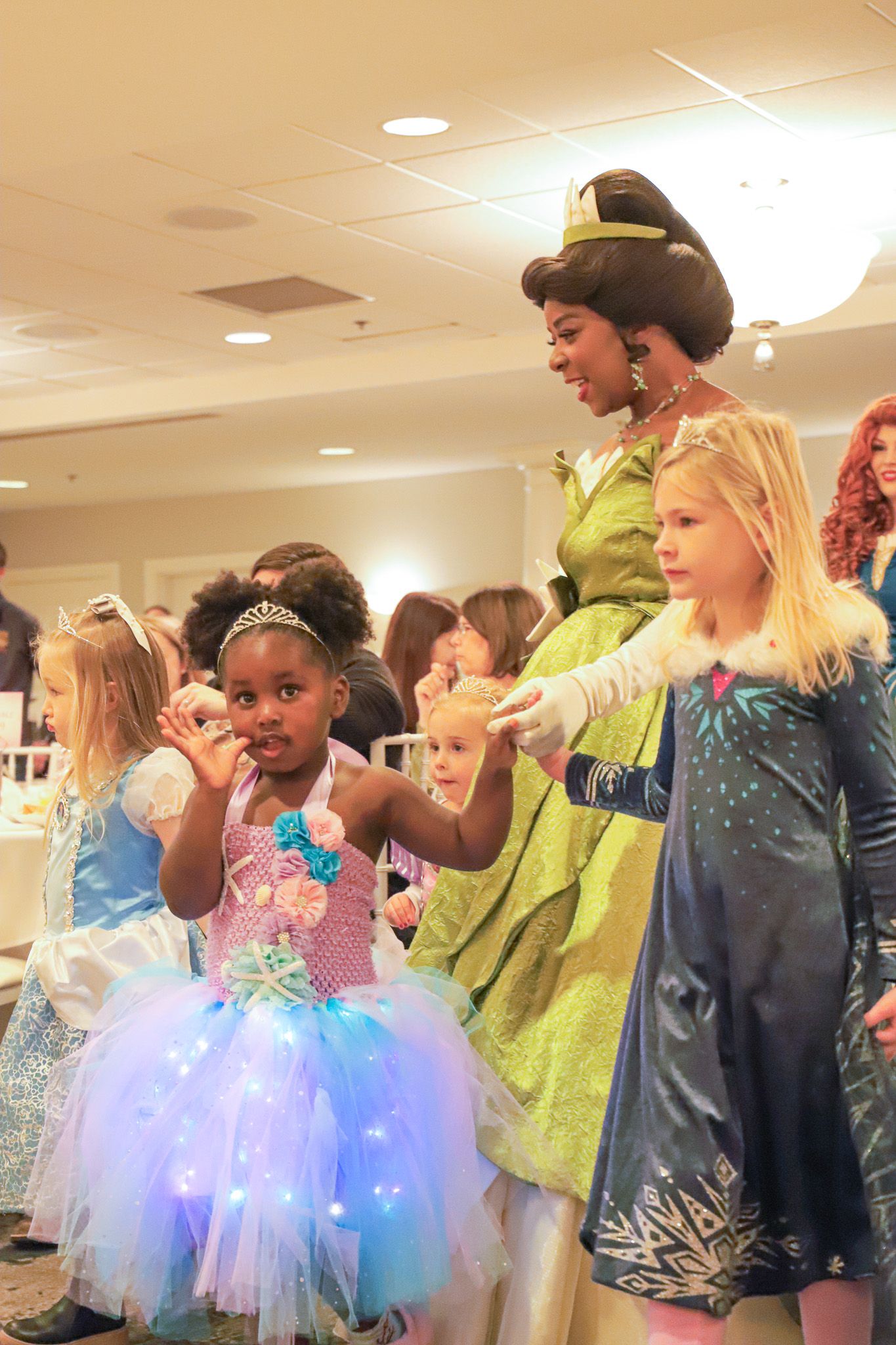 Young guests parade with Princess Gala characters, Inn at Bay Harbor