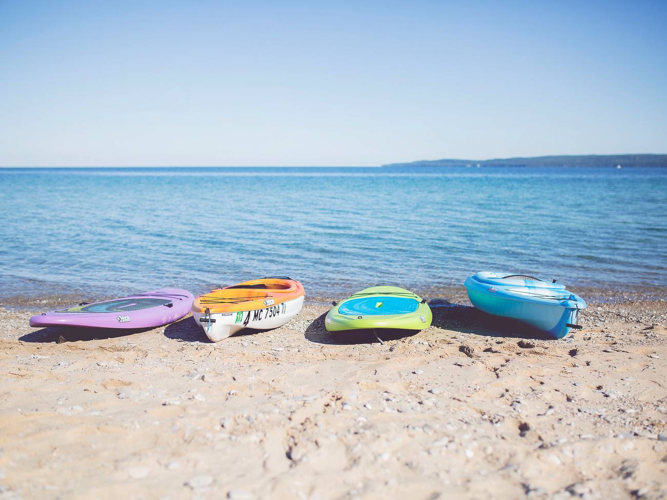 Paddle Boards and kayaks on shore, Little Traverse Bay