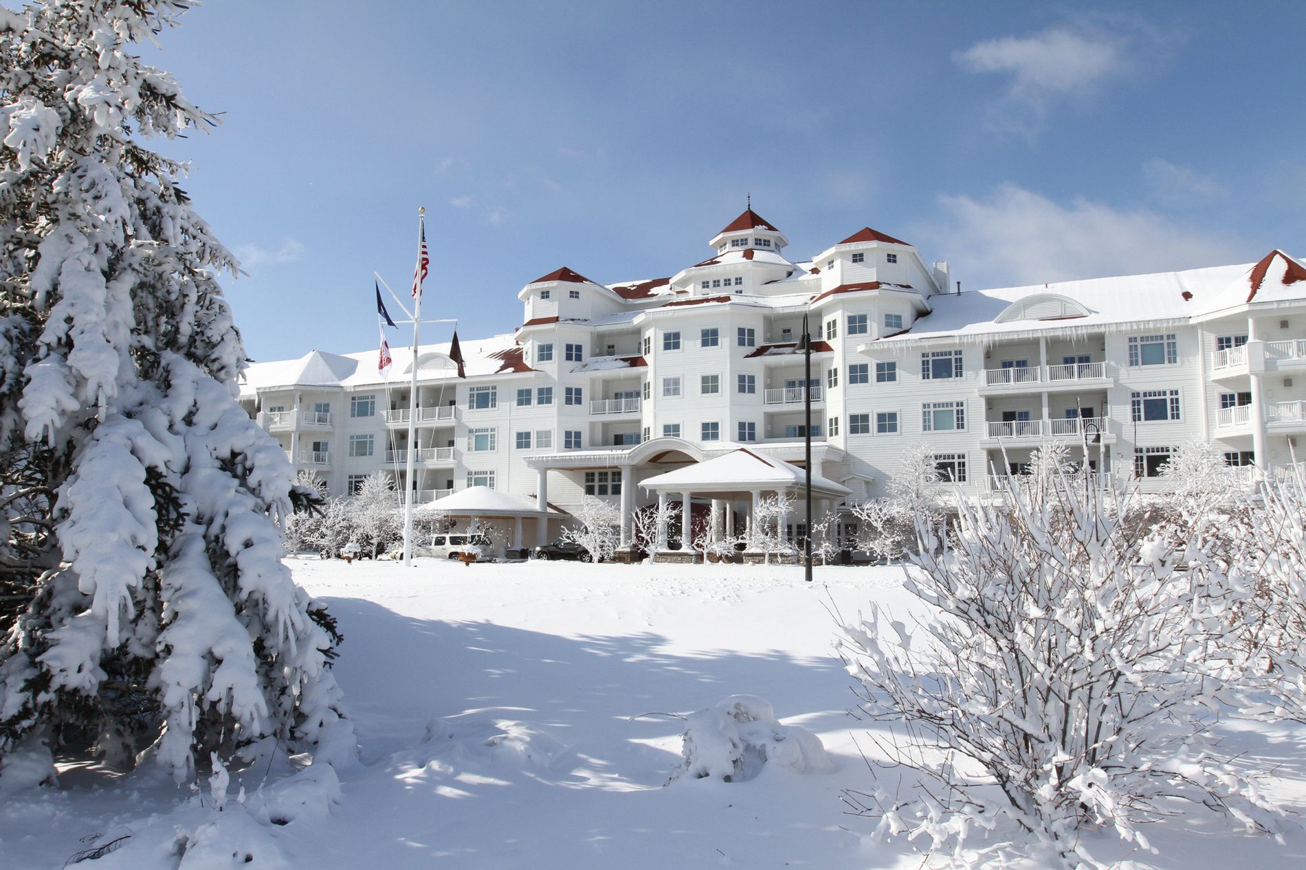 Fresh snow in front of exterior of Inn at Bay Harbor