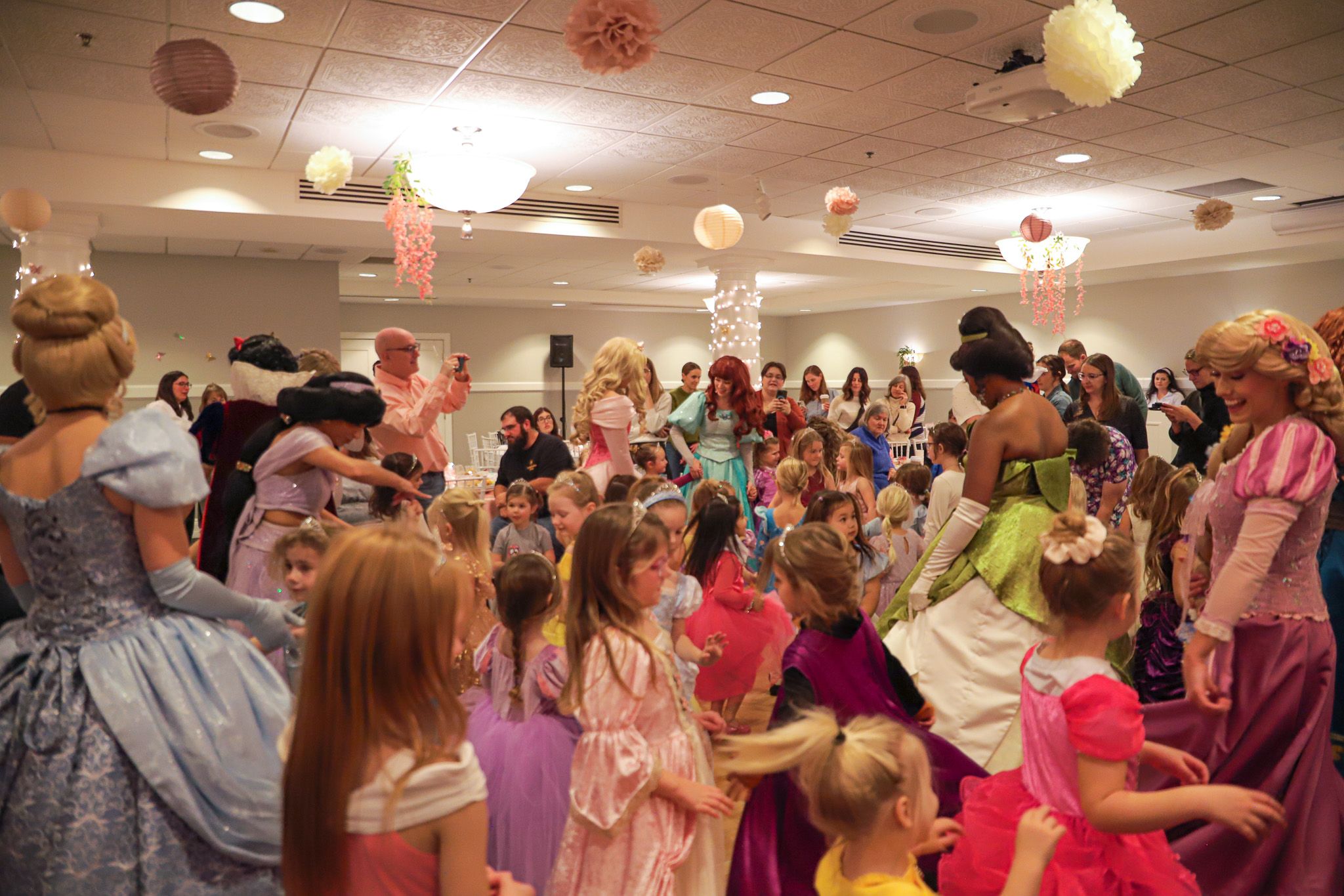 Princess characters dance with Princess Gala guests