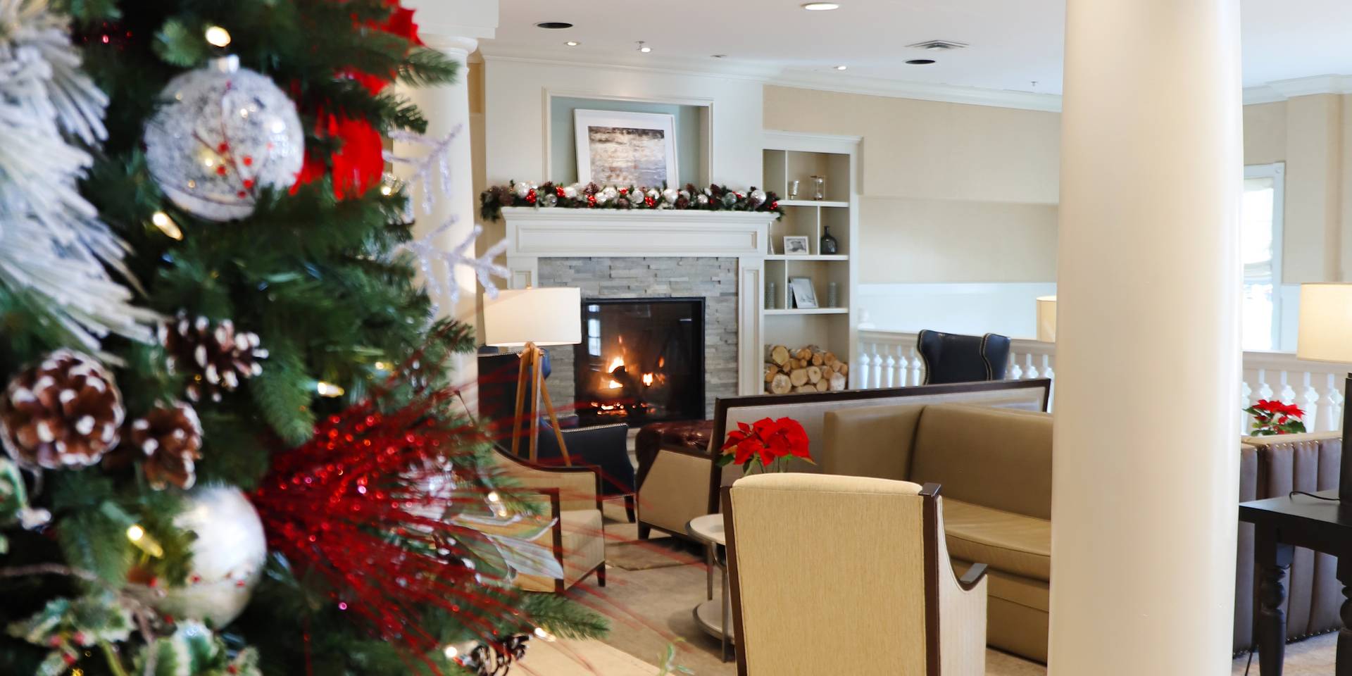 Inn at Bay Harbor red holiday decor and fireplace