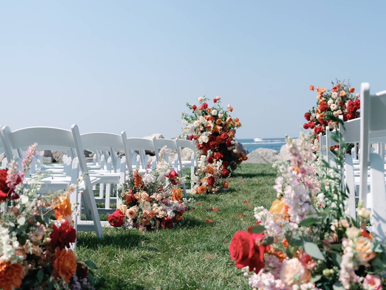 Red floral ceremony aisle detail