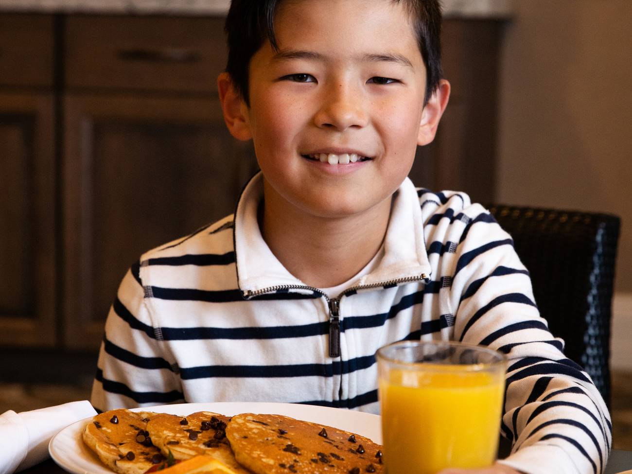 Child with chocolate chip pancakes