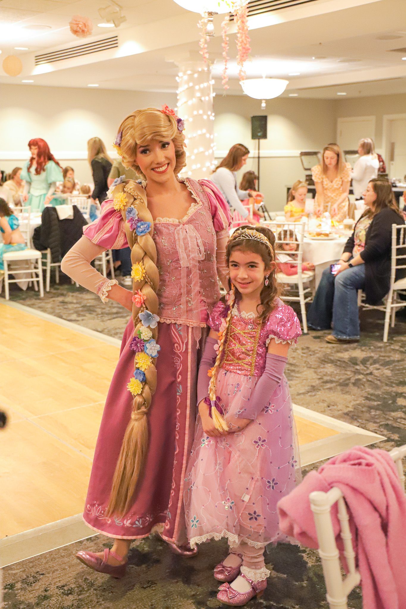 Rapunzel character poses with young guest, Princess Gala, Inn at Bay Harbor