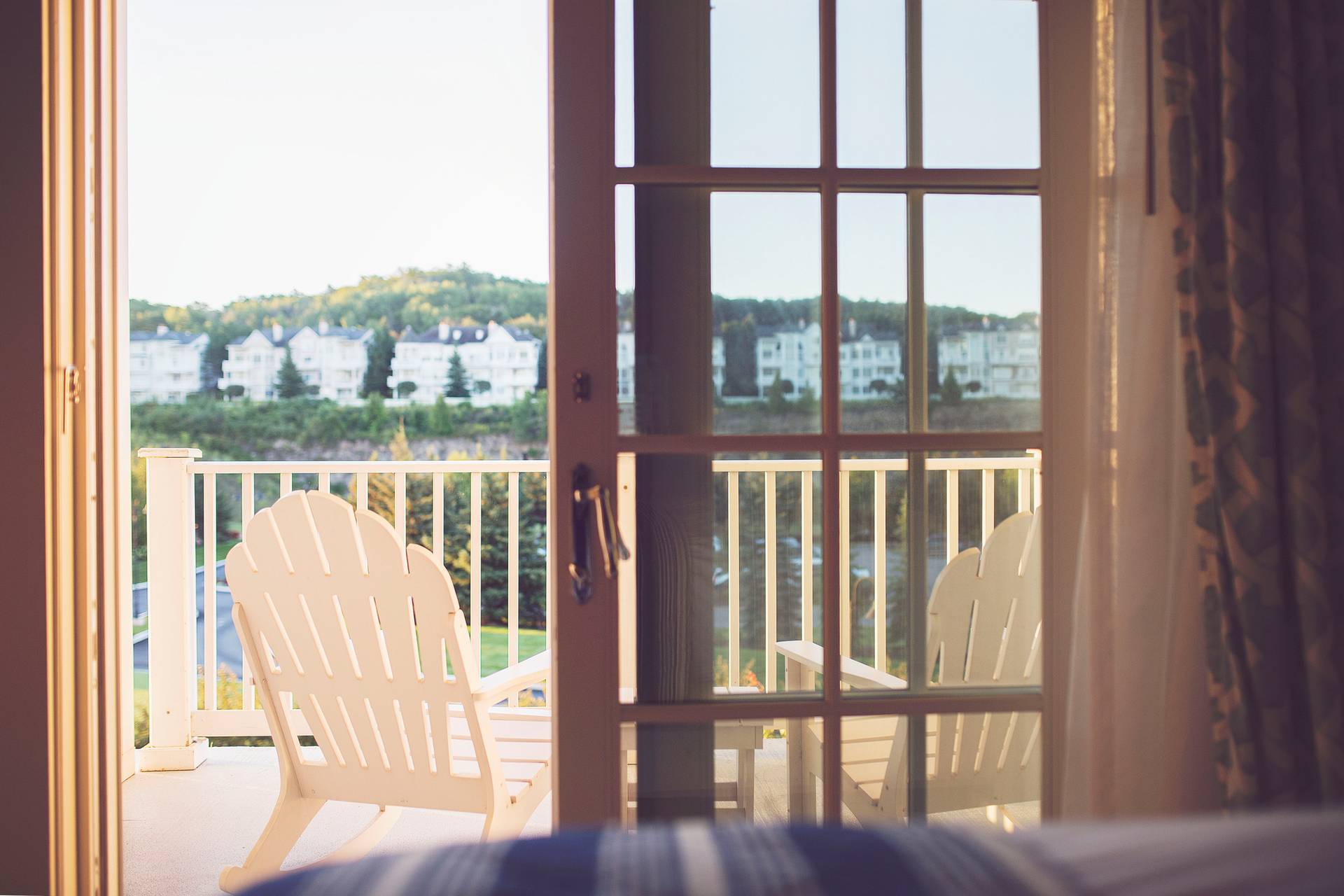 Looking out from a bedroom to a quarry side balcony