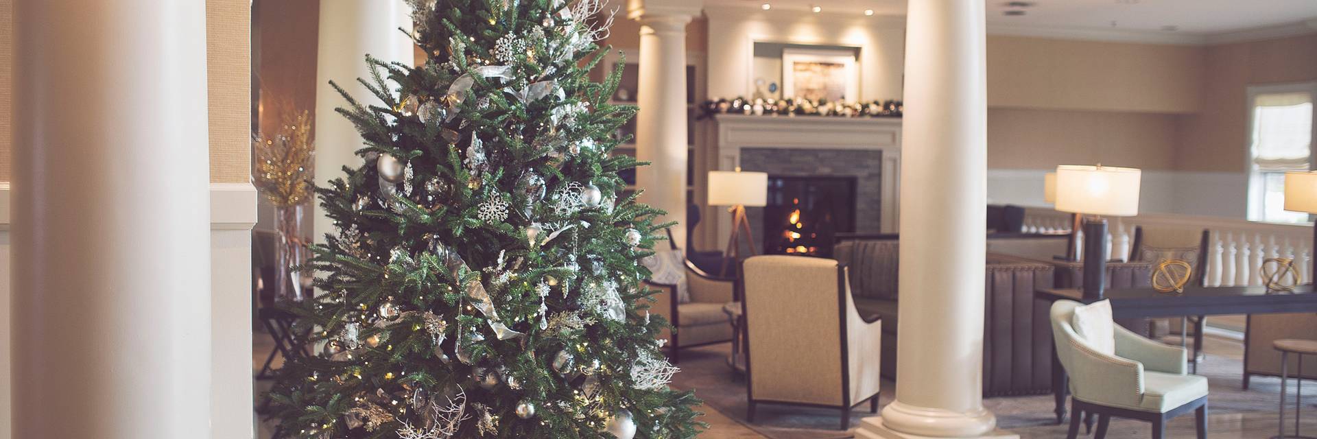 A silver and gold Christmas tree adorns the Inn at Bay Harbor lobby