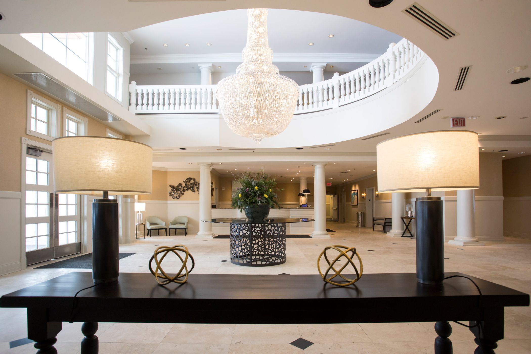 Inn at Bay Harbor entrance interior lamps, chandelier, and Reception desk