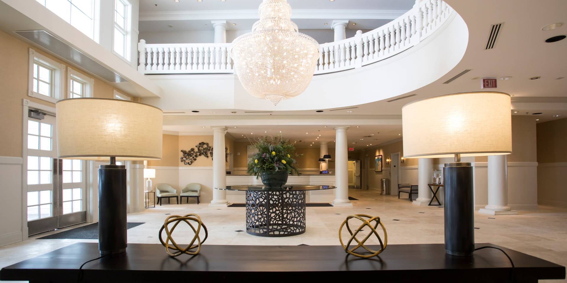 Inn at Bay Harbor entrance interior lamps, chandelier, and Reception desk