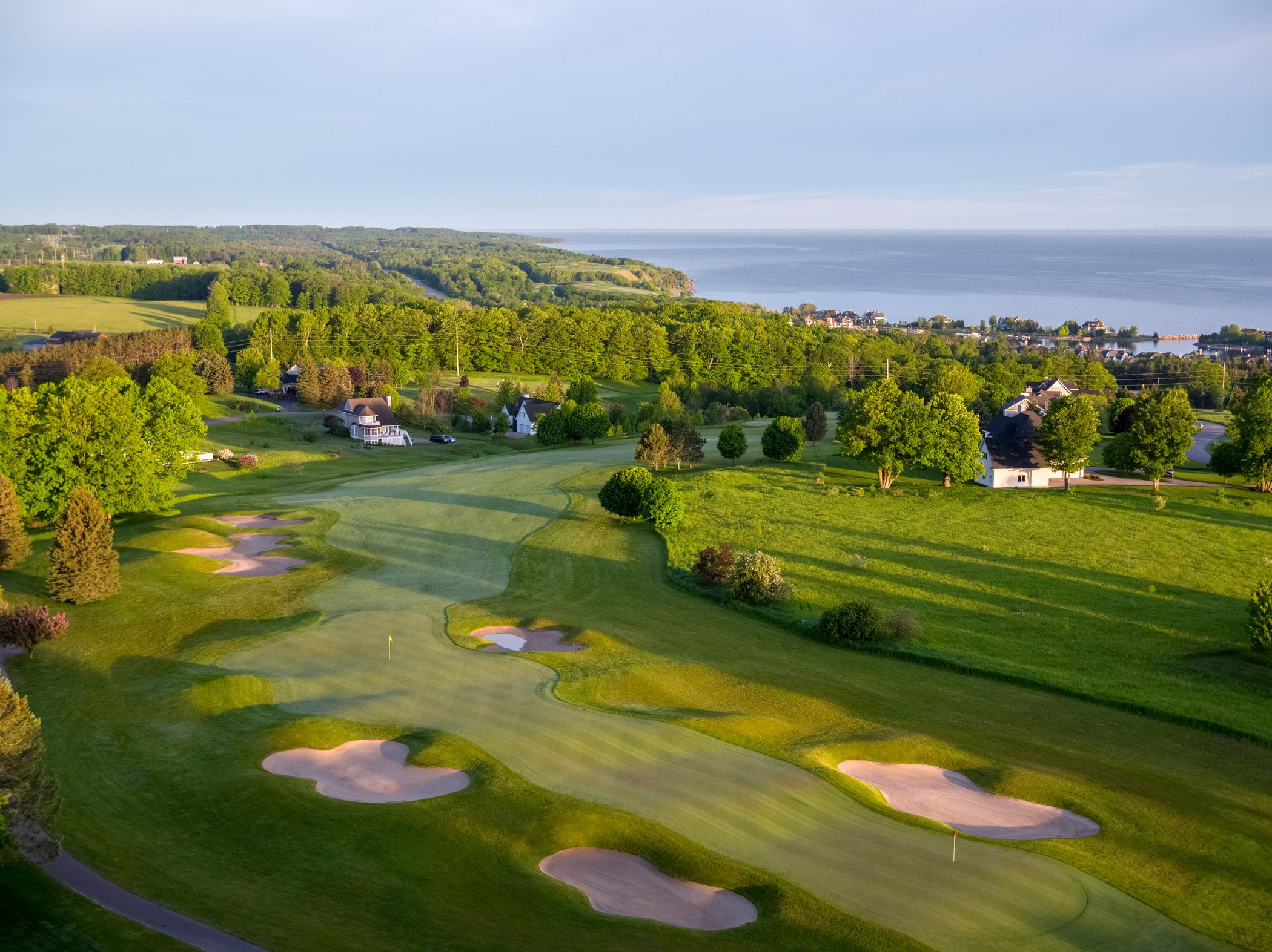 Crooked Tree Golf Club aerial morning light wide, Lake Michigan background