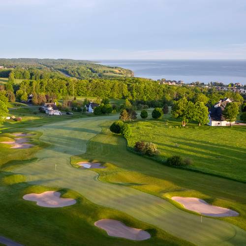 Crooked Tree Golf Club aerial morning light wide, Lake Michigan background