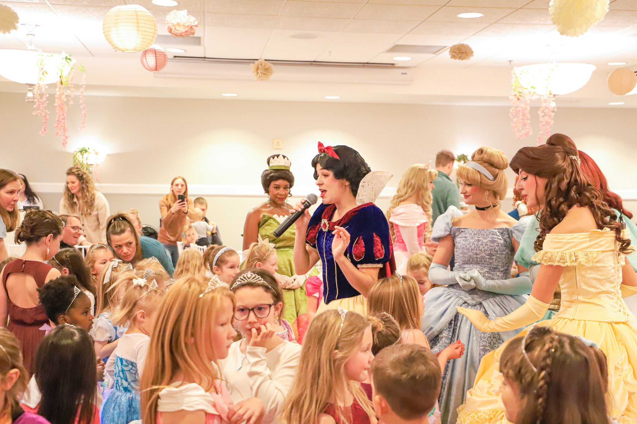 Snow White character talks to crowded Princess Gala dance floor, Inn at Bay Harbor