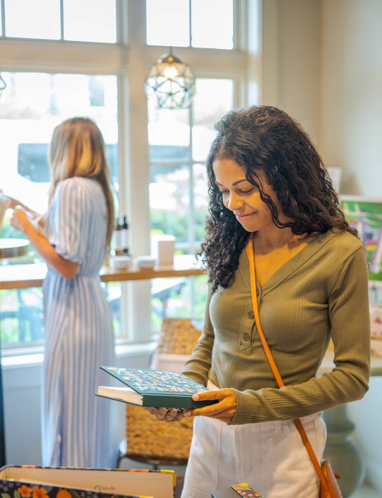 Woman shops Inn Cafe for gifts