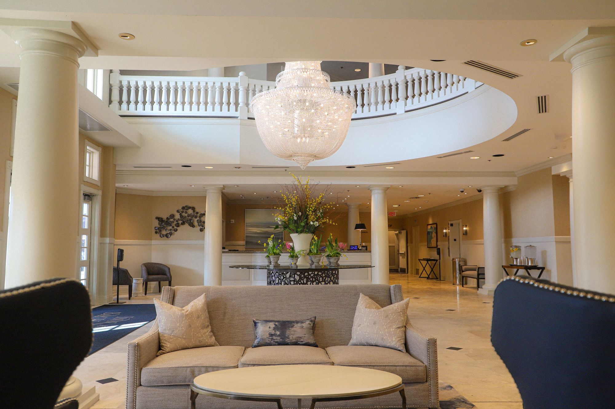 Spring floral arrangement under chandelier, Inn at Bay Harbor lobby