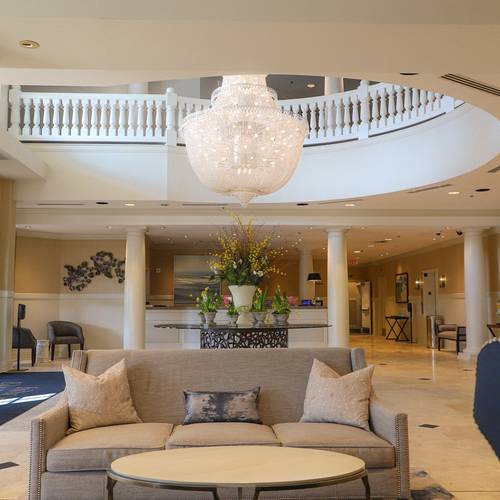 Spring floral arrangement under chandelier, Inn at Bay Harbor lobby