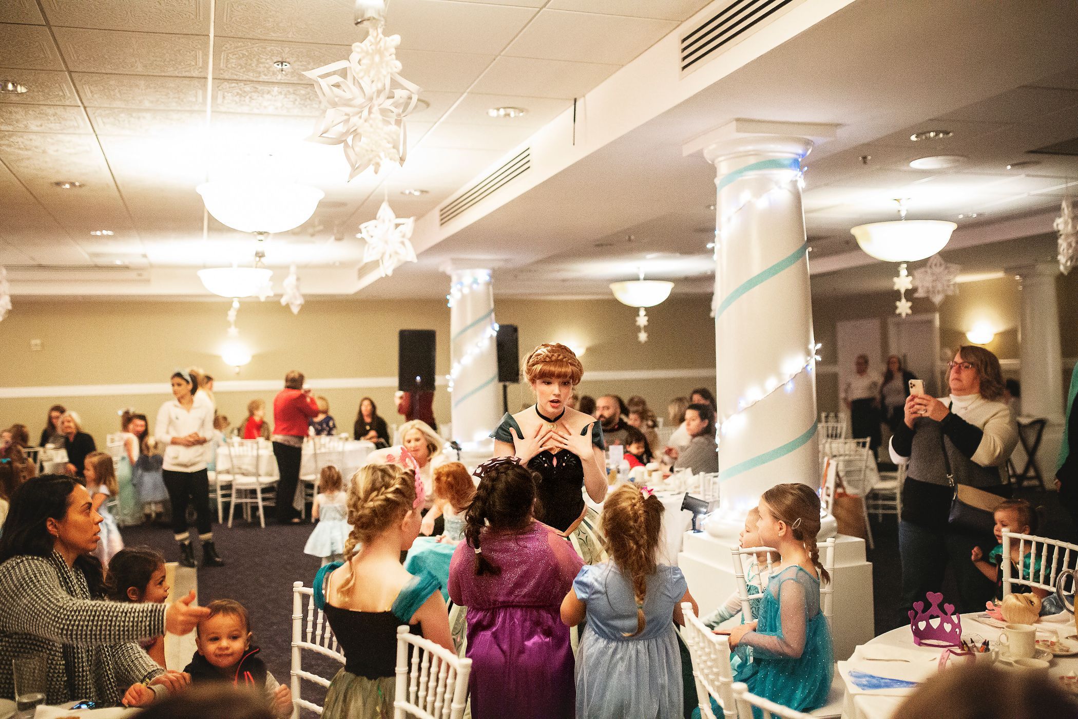 Anna character engages with young guests, Inn at Bay Harbor