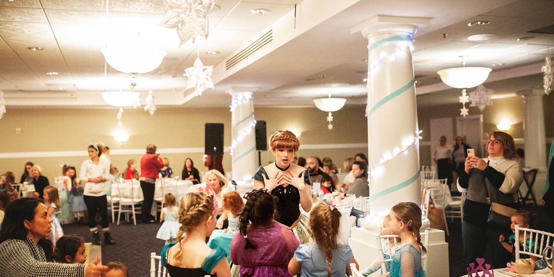 Anna character engages with young guests, Inn at Bay Harbor