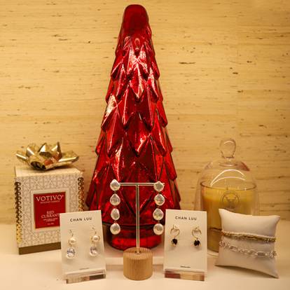Holiday jewelry and candle display at The Spa
