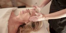 Woman receiving head massage, facial, The Spa at Inn at Bay Harbor