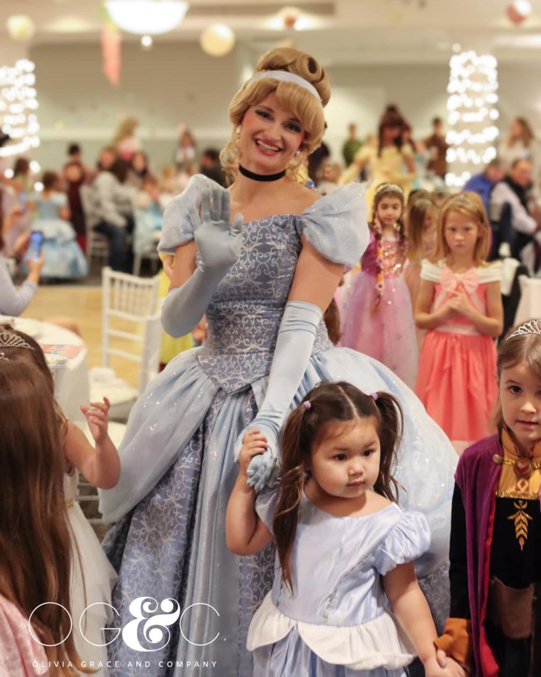 Cinderella character waves while parading with Princess Gala guests, Inn at Bay Harbor