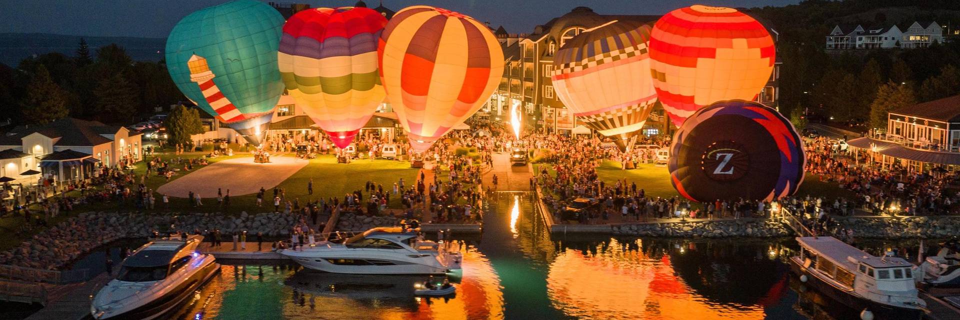 Balloons Over Bay Harbor 'Night Glow' evening hot air balloon aerial view