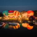 Balloons lit up in evening over Bay Harbor Lake Marina