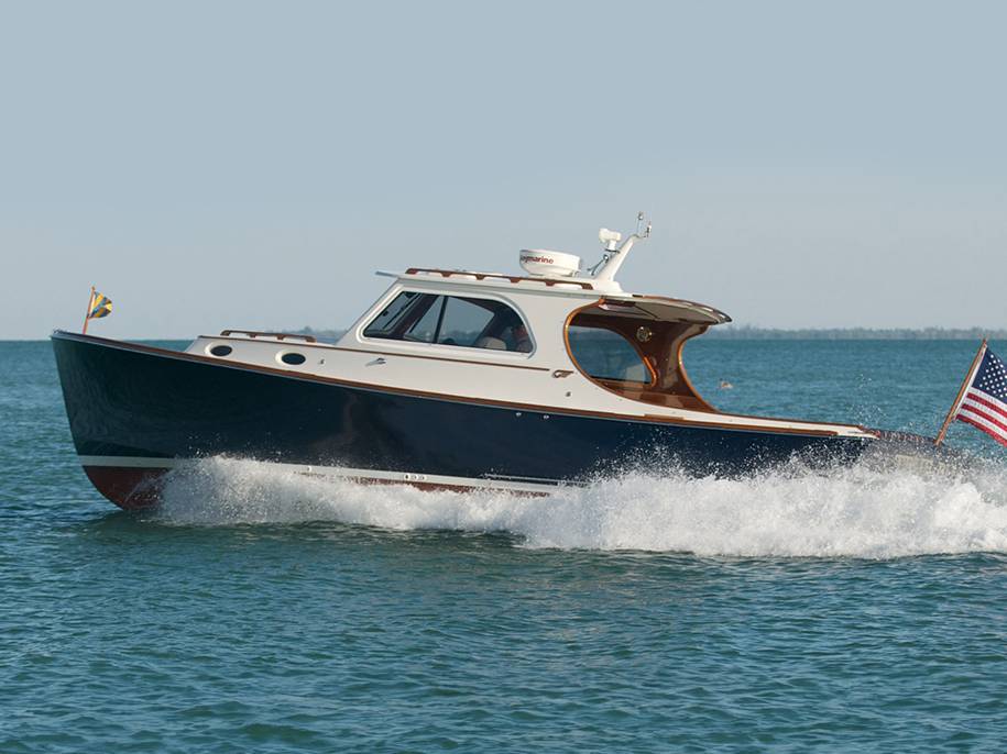 Lake Escapes Hinckley yacht speeding along water