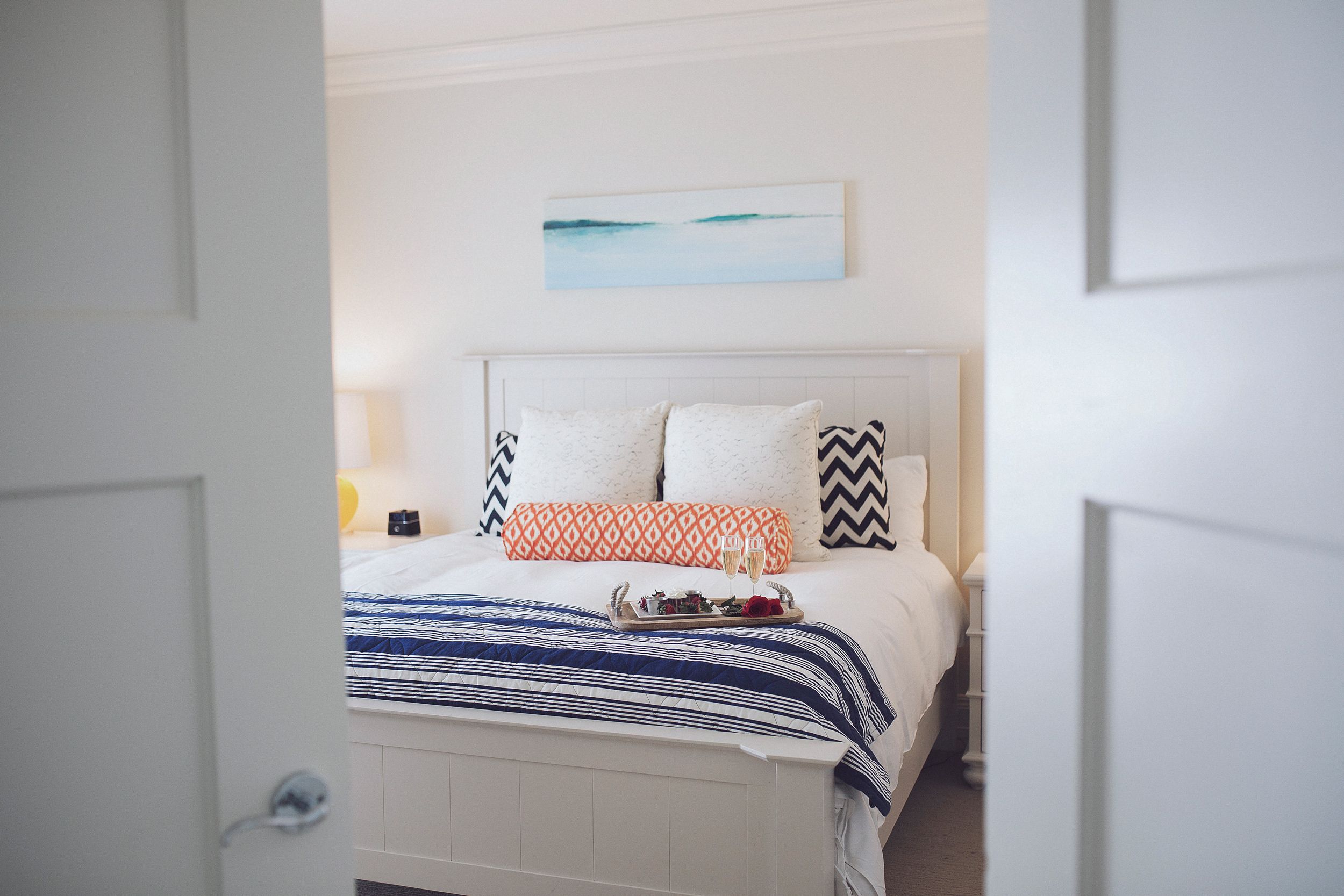 Master Suite, Inn at Bay Harbor, king bed with tray through bedroom doors