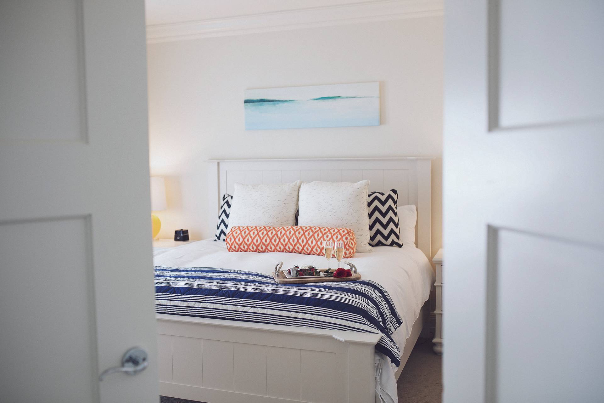 Master Suite, Inn at Bay Harbor, king bed with tray through bedroom doors