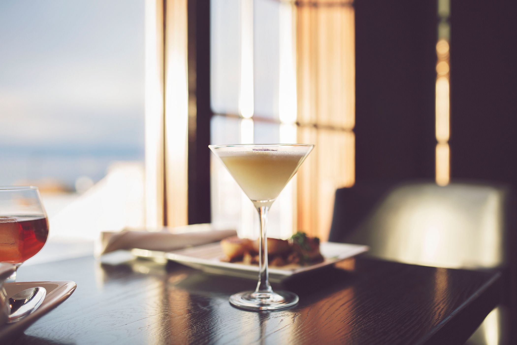 Winter cocktail detail, dinner table with snowy window seat view, Vintage Chophouse | Wine Bar