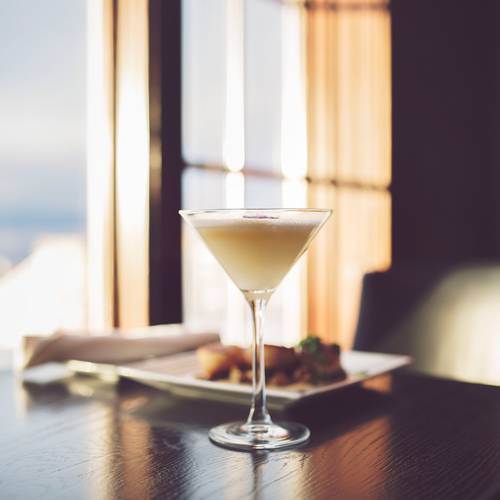 Winter cocktail detail, dinner table with snowy window seat view, Vintage Chophouse | Wine Bar
