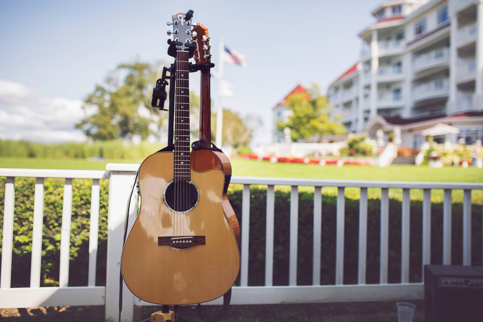 Acoustic guitar displayed on stand on outdoor patio of Inn at Bay Harbor