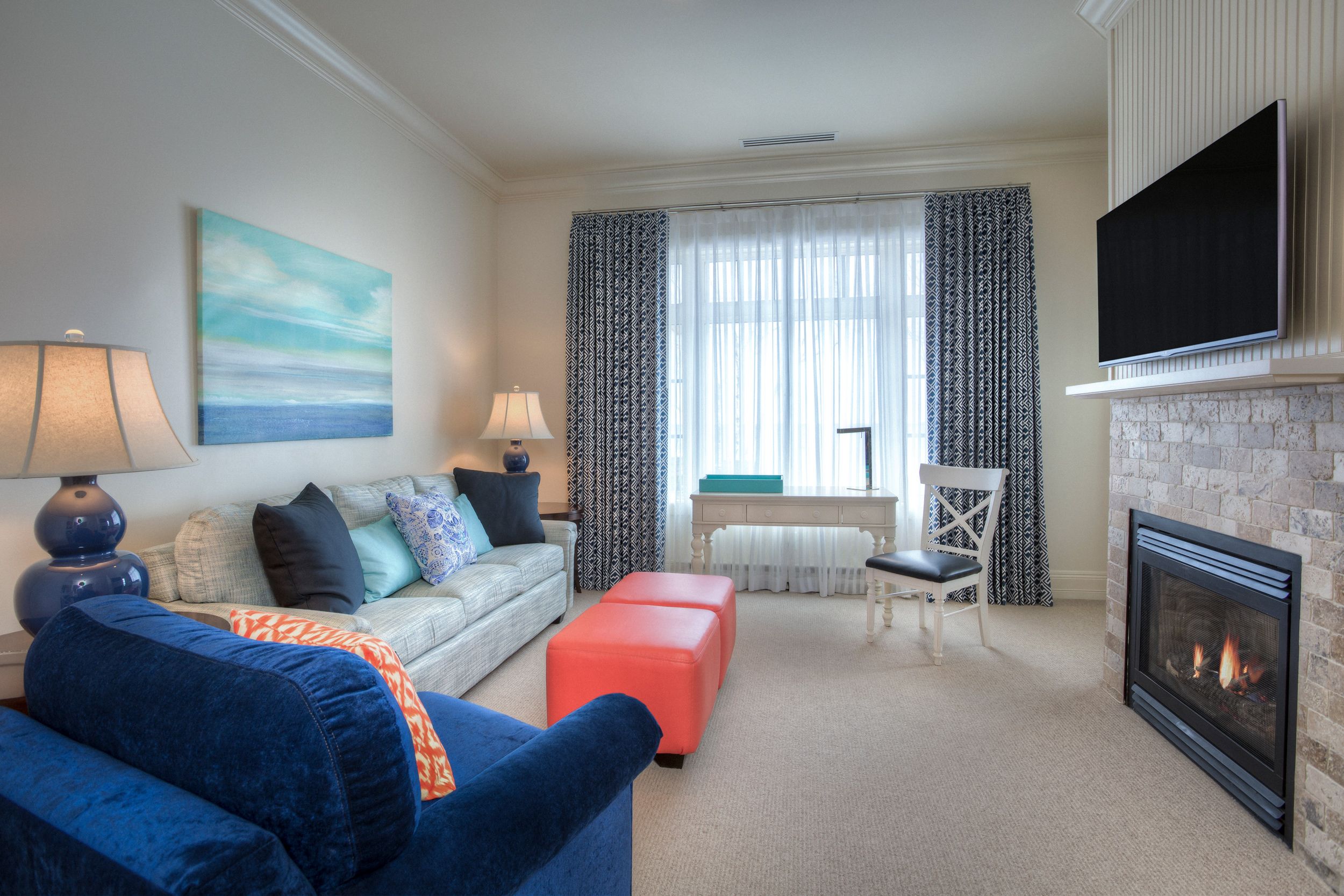 Master Suite, Inn at Bay Harbor, living area seating and fireplace