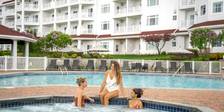 Three women friends chat in springtime hot tub