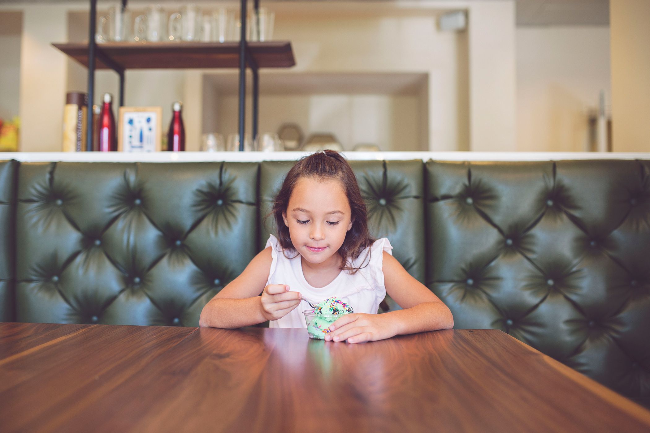 Young girl eating ice cream, Inn Cafe