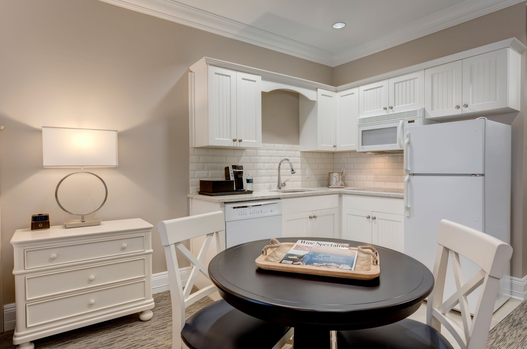Corner kitchenette and dining table in hotel room