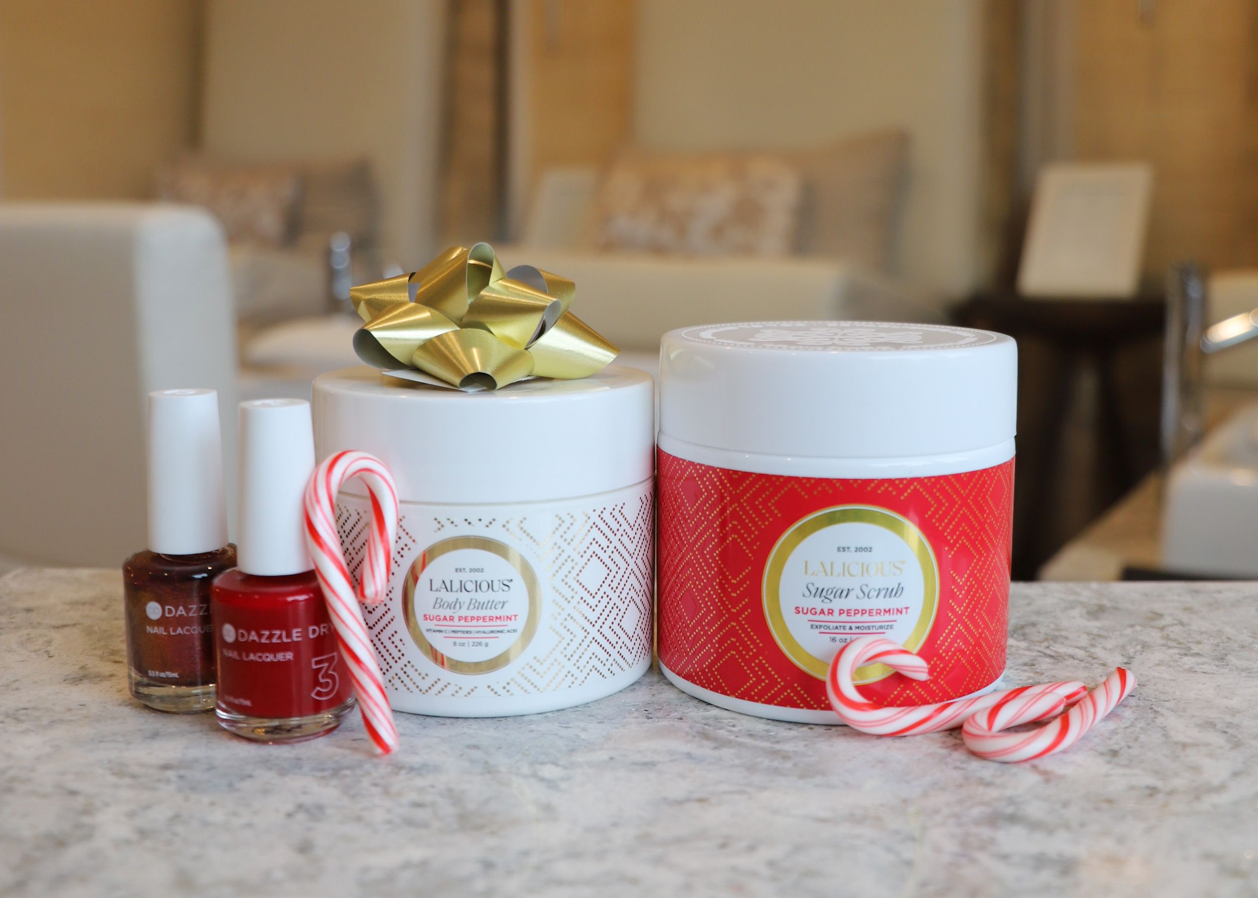 Lalicious peppermint body products with red nail polish, candy canes at The Spa