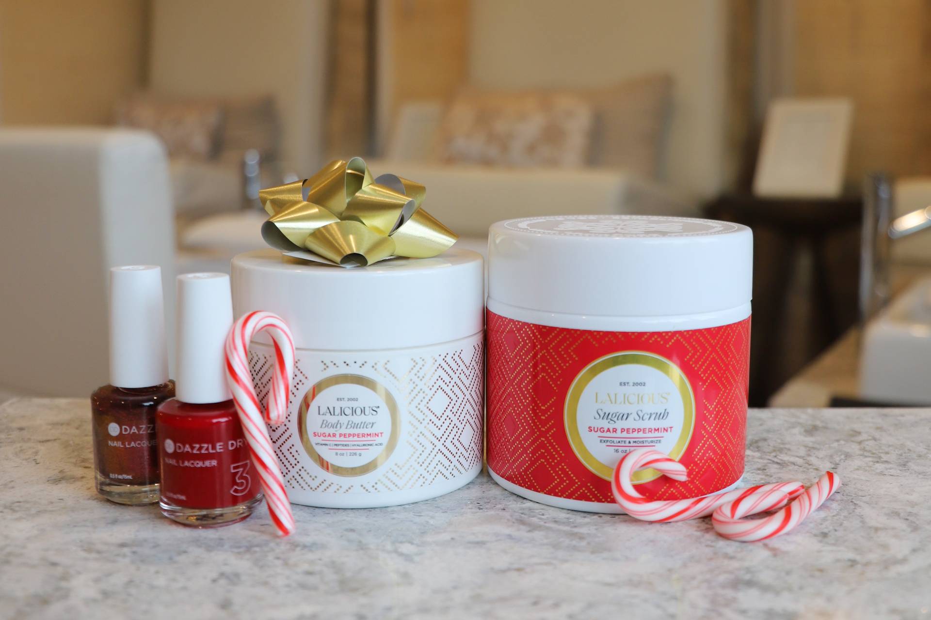 Lalicious peppermint body products with red nail polish, candy canes at The Spa