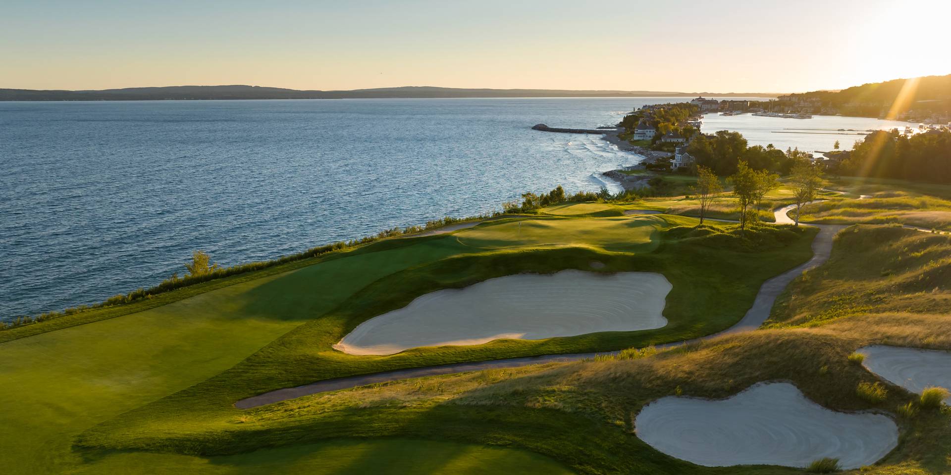 Sunrise over Bay Harbor Golf Club course on Lake Michigan