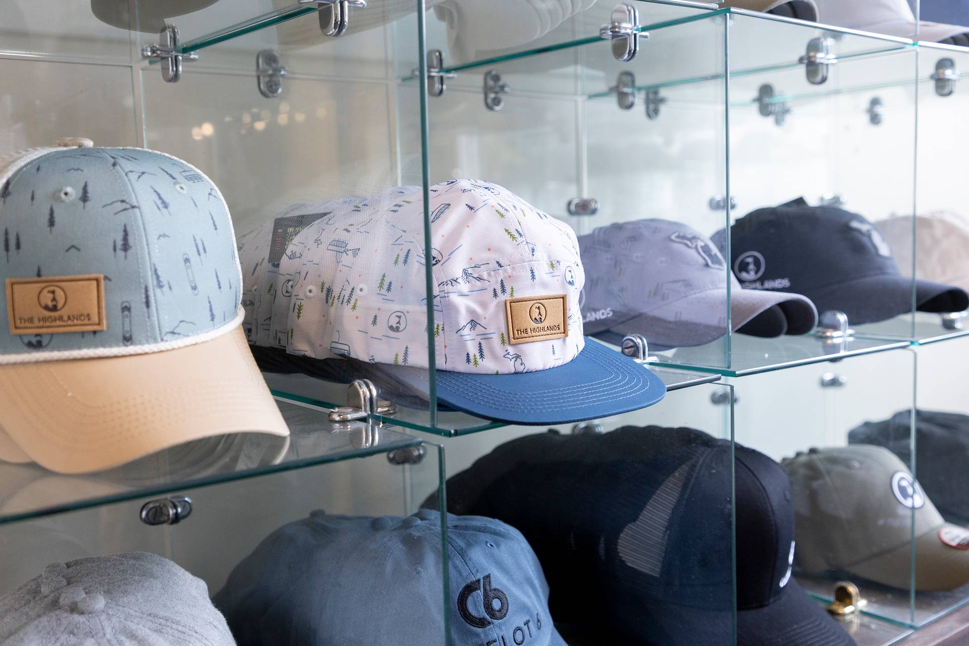 The Highlands logo hats at Boyne Country Sports