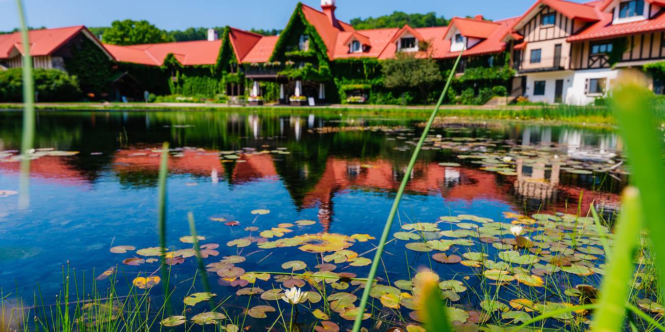 The Highalnds front pond with the Main Lodge in the background