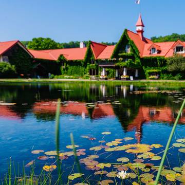 The Highalnds front pond with the Main Lodge in the background