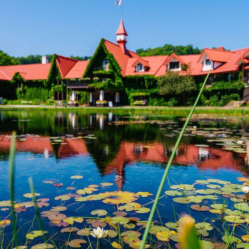 The Highalnds front pond with the Main Lodge in the background