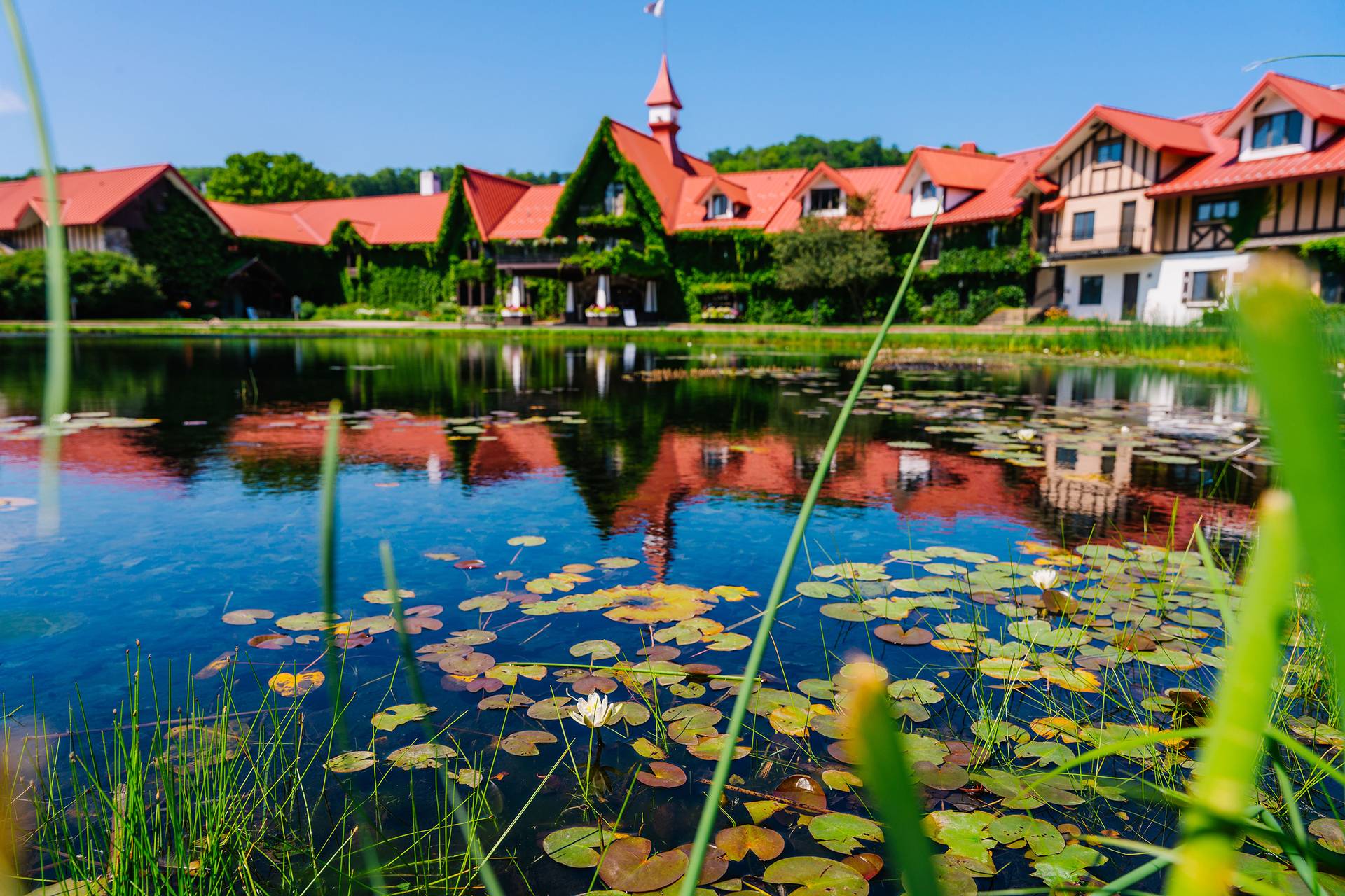 The Highalnds front pond with the Main Lodge in the background